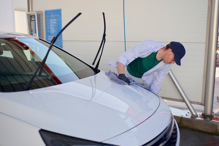 Drying car hood with microfiber cloth