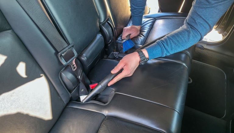 Vacuuming car interior